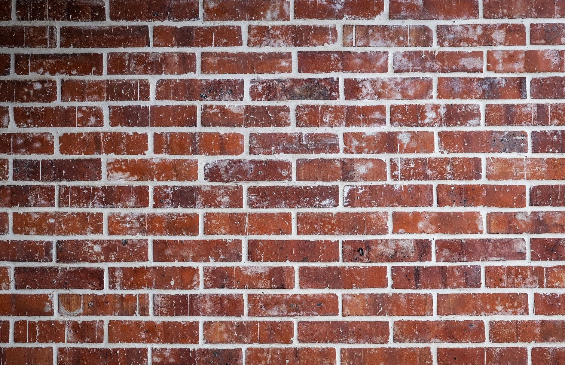 Muur van rode baksteen van dichtbij